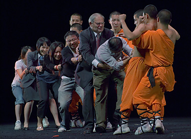  A group of about 30 young Shaolin Monks from China visit Auckland during the Chinese new festival. They perform Shaolin Kungfu in Skycity, Aotea centre and the Lantern festival. The photo was taken when a Shaolin monk use the belly (feat of strength) holding a rice bowl. But seven audiences cannot pull it out!